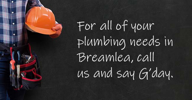 A plumber standing with text on the background relating to Breamlea plumbing services