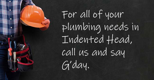 A plumber standing with text on the background relating to Indented Head plumbing services