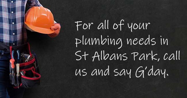 A plumber standing with text on the background relating to St Albans Park plumbing services