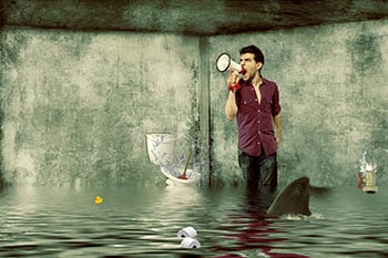 stylistic flooding image with floating objects and a man calling for help